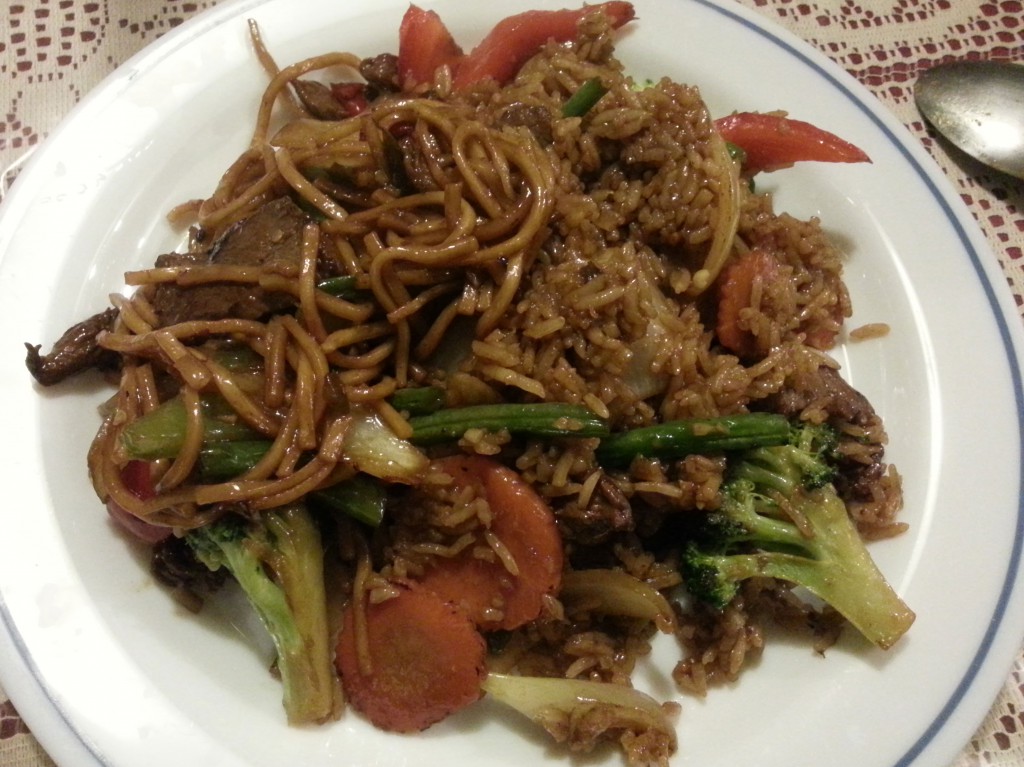stir fried spicy noodles with fresh chilli, green beans, spring onion and basil leaves