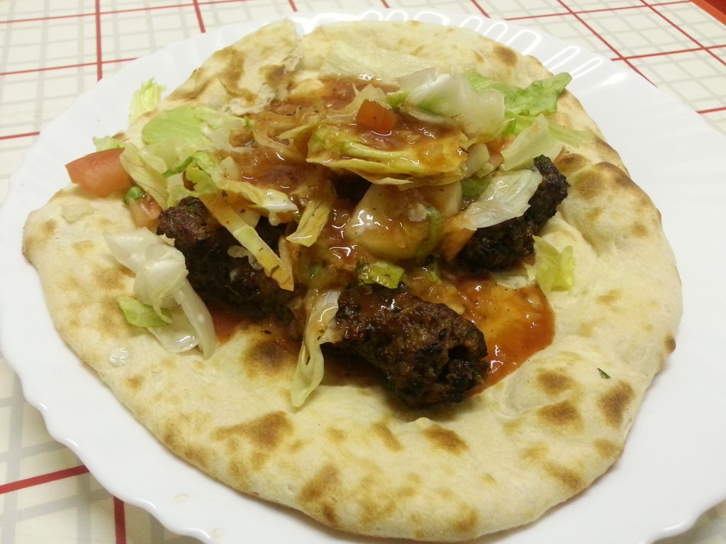 Large Shahi nan kebab in fresh nan with extra chilly sauce and garlic sauce.