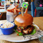 cabana SPICY MALAGUETA CHICKEN BURGER 9.95 Our Spicy Malagueta Chicken in a brioche bun, with avocado, tomato, lettuce & Malagueta Mayo. Life is good. With Fries & Slaw – 12.95