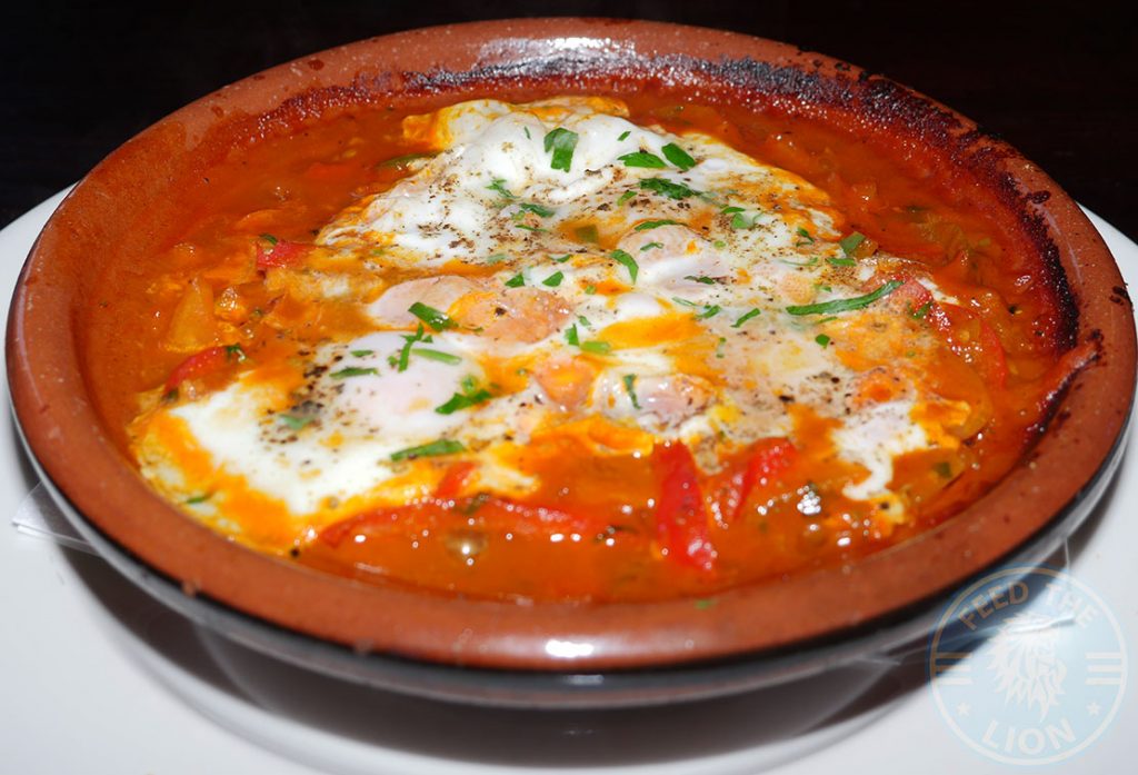 Shakshuka Omelette - Moroccan spiced minced meat oven-cooked in roasted tomato's, peppers, onions & topped with eggs. £6.50